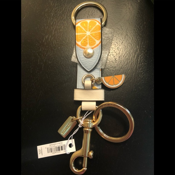 Coach Accessories - ⬇️ COACH Trigger Snap Bag Charm w/ Orange Print🍊